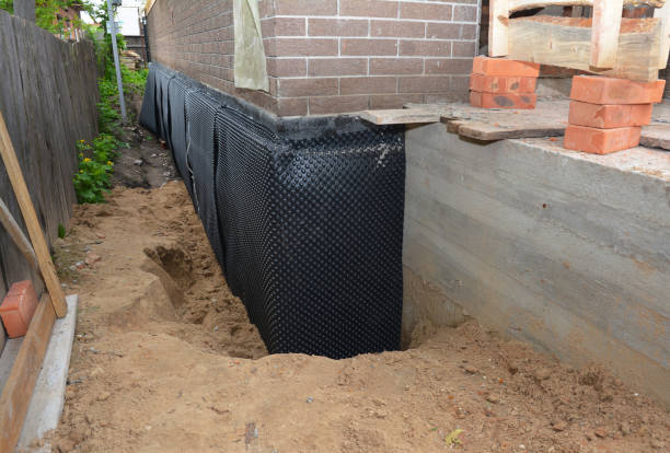 Happy homeowners after waterproofing job in Gresham